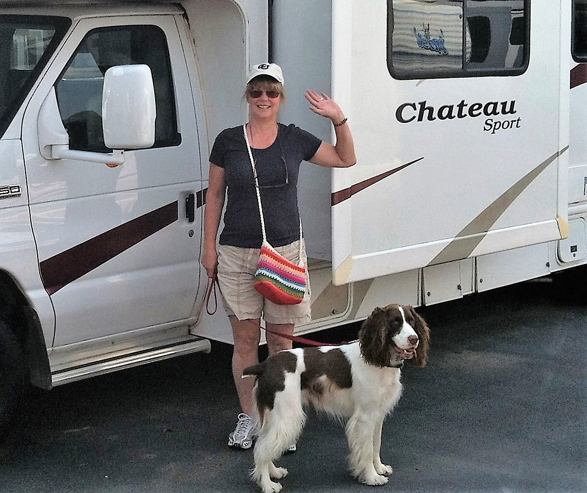 Me with my third English Springer Spaniel, Scout, and our camper in 2015